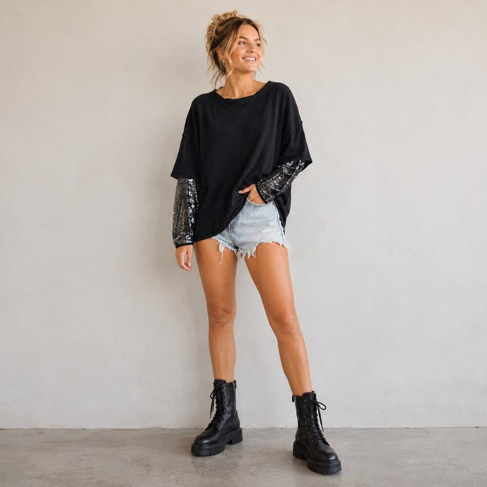Free People Oversized vintage wash black top with sequined sleeves. Women L
